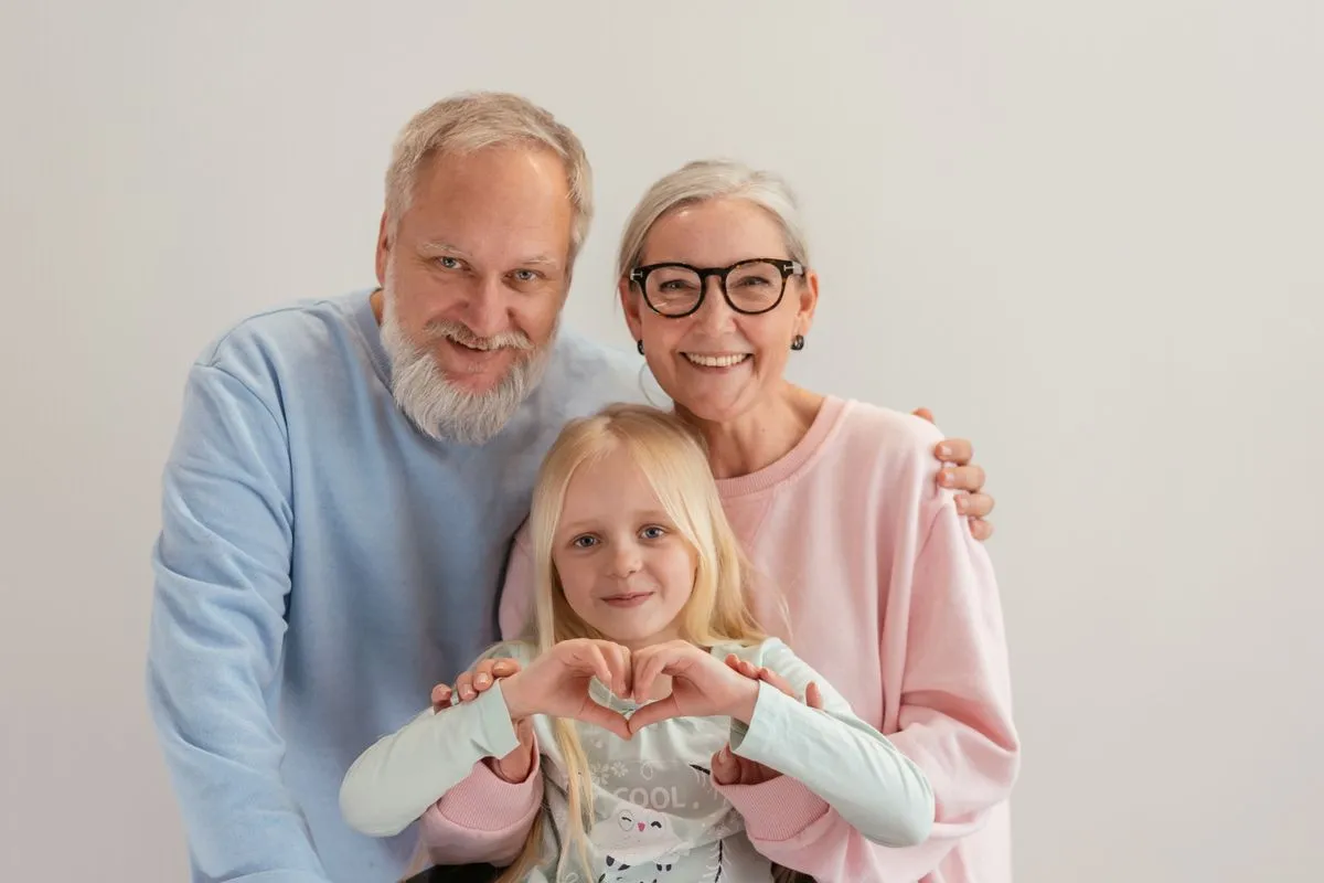Grandparents with their young granddaughter